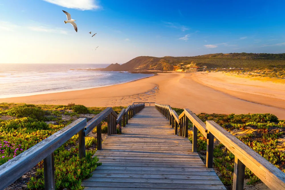 A quiet sunset over the dunes and long sandy beach in Comporta