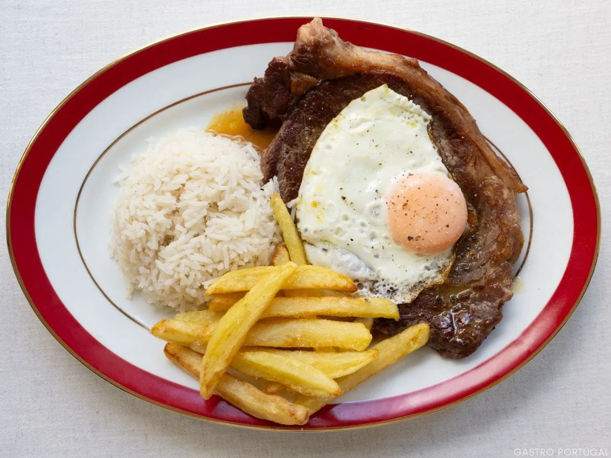 Bitoque steak topped with a fried egg and fries